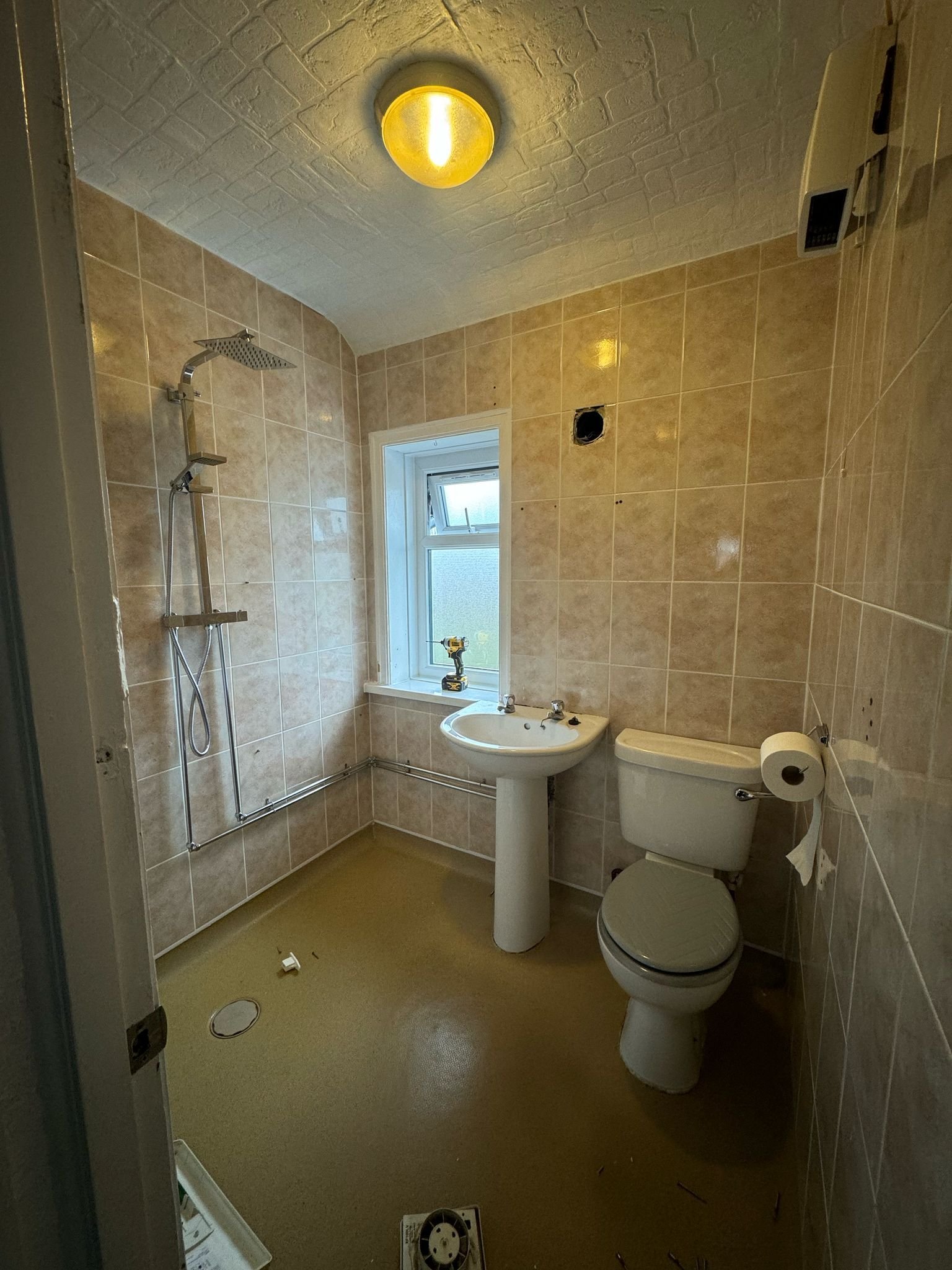 Luxury bathroom renovation with premium wall finishes and modern fittings