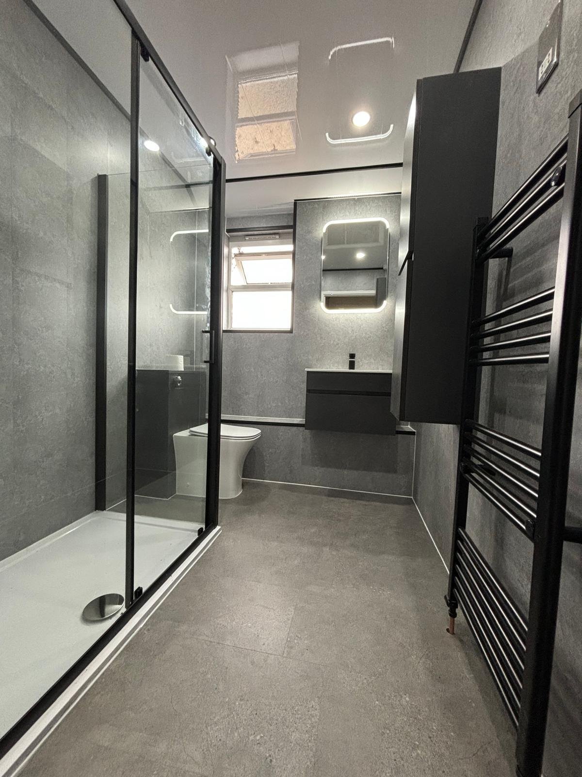 Modern bathroom renovation with premium wall panels
